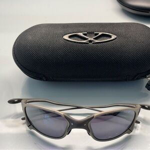 Oakley Titanium Silver Frame Sunglasses with Gray Lenses